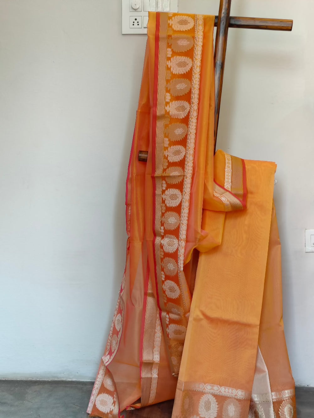 Orange chanderi weave saree with golden border 